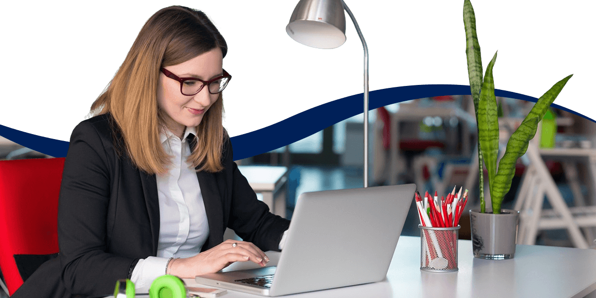 Woman Working On A Laptop To Choose A Bill Management Software