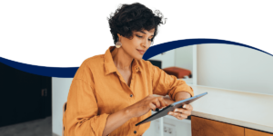 Woman using a tablet to engage with utility billing software